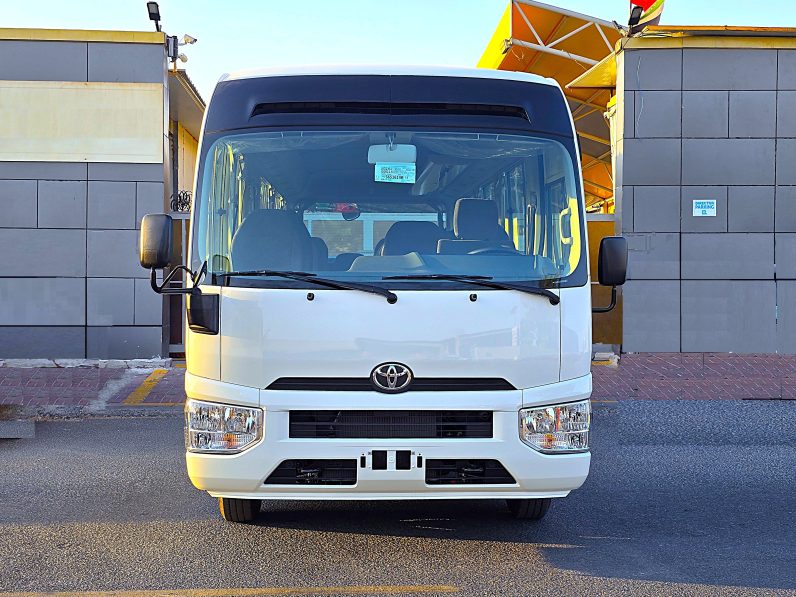 TOYOTA COASTER PETROL 2.7 MT – AUTO DOOR – 23 SEATER – 2 POINT BELT – 2025 MODEL – WHITE 