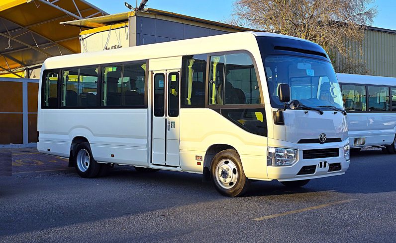 TOYOTA COASTER PETROL 2.7 MT – AUTO DOOR – 23 SEATER – 2 POINT BELT – 2025 MODEL – WHITE 