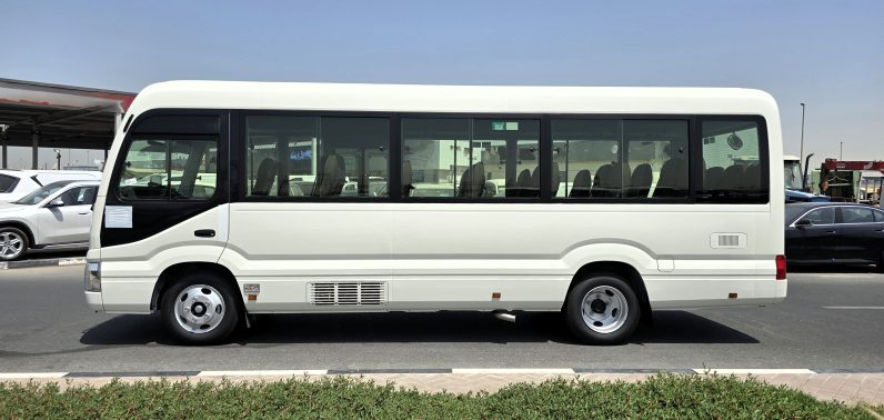 TOYOTA COASTER PETROL 2.7 MT – AUTO DOOR – 23 SEATER – 3 POINT BELT – 2025 MODEL – WHITE