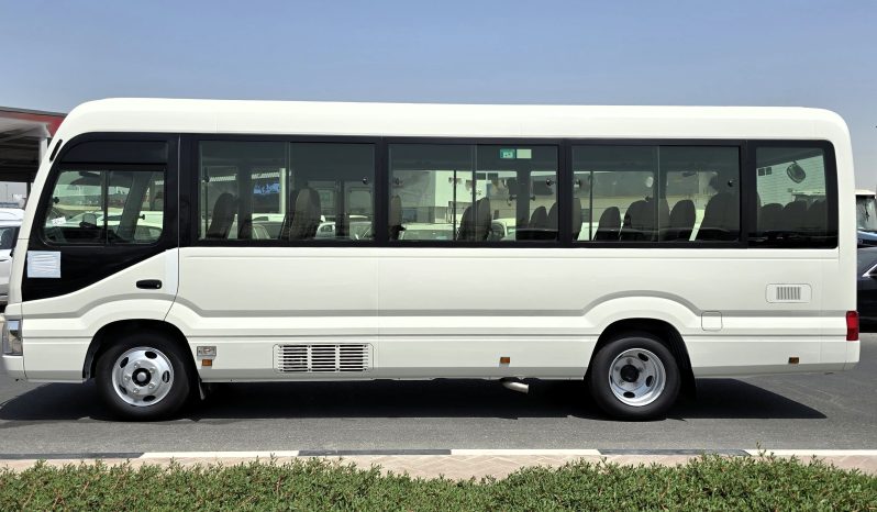 
								TOYOTA COASTER PETROL 2.7 MT – AUTO DOOR – 23 SEATER – 3 POINT BELT – 2025 MODEL – WHITE full									