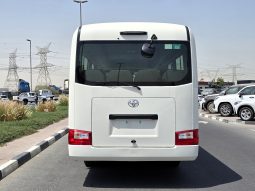 
										TOYOTA COASTER PETROL 2.7 MT – AUTO DOOR – 23 SEATER – 3 POINT BELT – 2025 MODEL – WHITE full									